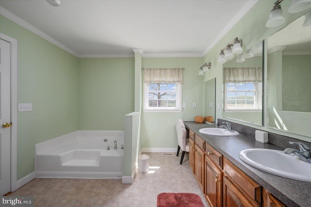 full bath with a bath, crown molding, a sink, and baseboards