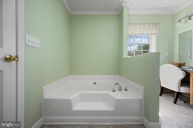 bathroom featuring ornamental molding, a bath, and baseboards