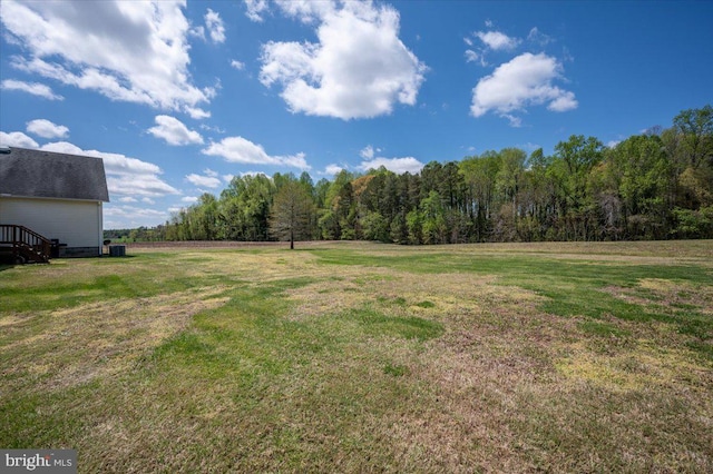 view of yard with a wooded view