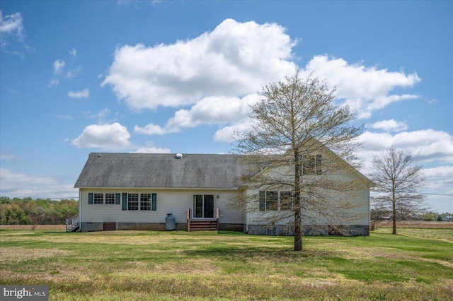 back of house featuring a yard, entry steps, and crawl space