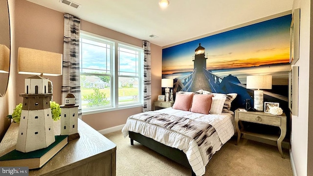 carpeted bedroom featuring baseboards, multiple windows, and visible vents