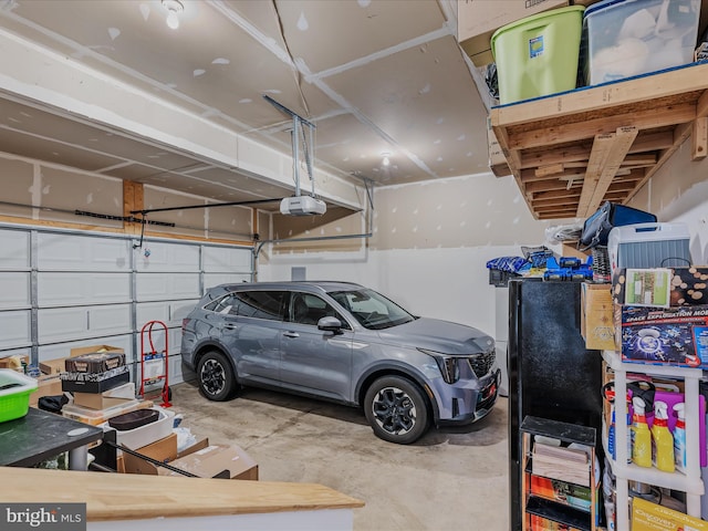 garage featuring a garage door opener