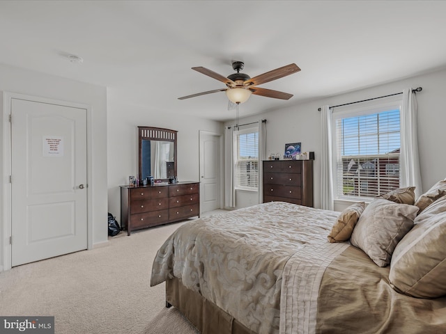 carpeted bedroom featuring a ceiling fan