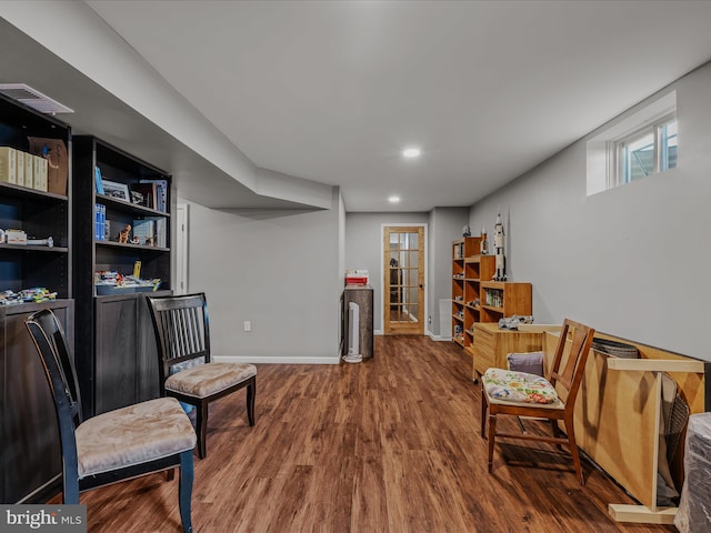 sitting room featuring baseboards, recessed lighting, and wood finished floors