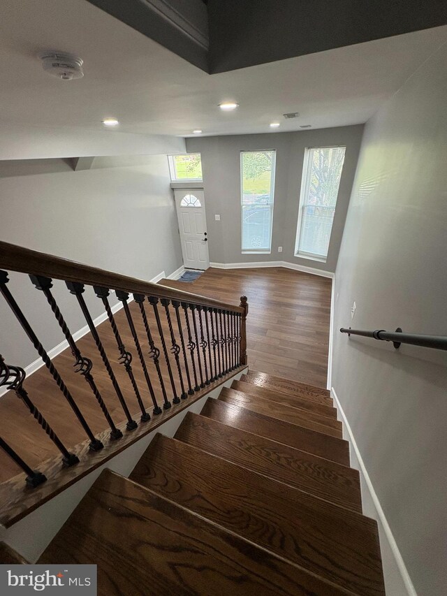 2241 E Preston St, Baltimore, MD 21213 - stairs featuring baseboards, recessed lighting, and wood finished floors
