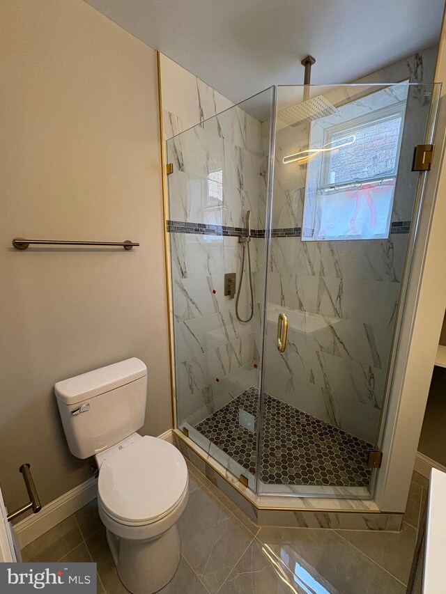 2241 E Preston St, Baltimore, MD 21213 - bathroom with toilet, a marble finish shower, and baseboards