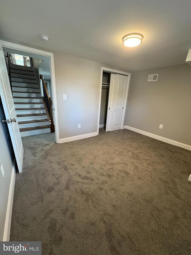 2241 E Preston St, Baltimore, MD 21213 - unfurnished bedroom with carpet, a closet, and baseboards