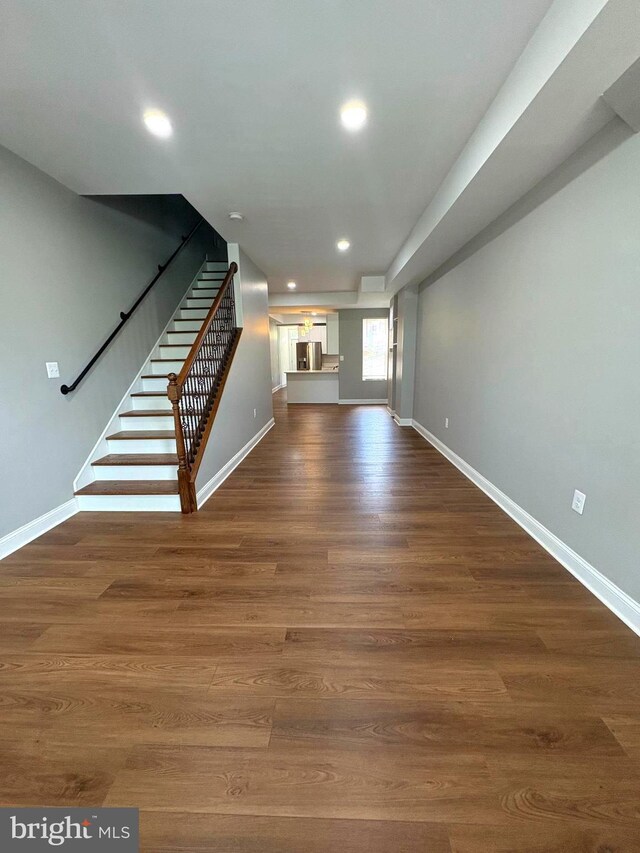 2241 E Preston St, Baltimore, MD 21213 - unfurnished living room with stairway, baseboards, recessed lighting, and wood finished floors