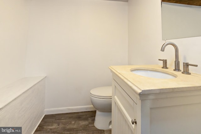 206 Paris Ave, Brooklawn, NJ 08030 - half bathroom featuring toilet, wood finished floors, vanity, and baseboards