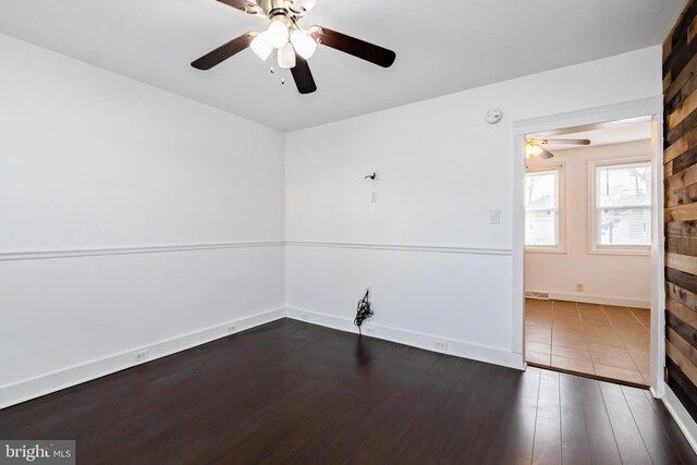 206 Paris Ave, Brooklawn, NJ 08030 - empty room with wood finished floors, baseboards, and a ceiling fan