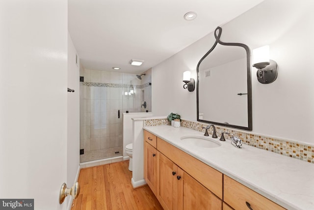 1925 Upper Lake Dr, Reston, VA 20191 - full bath with toilet, a stall shower, wood finished floors, vanity, and recessed lighting