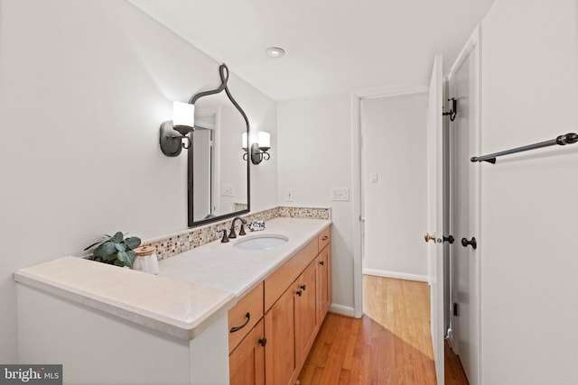 1925 Upper Lake Dr, Reston, VA 20191 - bathroom featuring wood finished floors, vanity, and baseboards