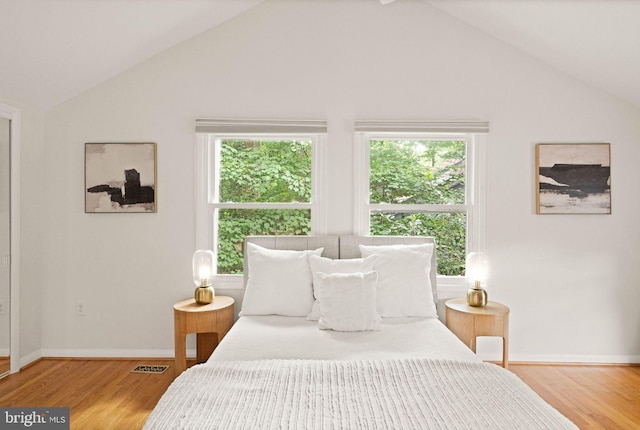 1925 Upper Lake Dr, Reston, VA 20191 - bedroom featuring vaulted ceiling, light wood-type flooring, and baseboards