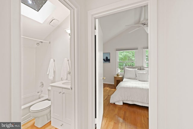 1925 Upper Lake Dr, Reston, VA 20191 - full bath featuring wood finished floors, lofted ceiling, a skylight, and toilet
