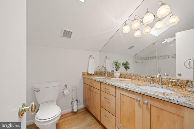 1925 Upper Lake Dr, Reston, VA 20191 - full bathroom with toilet, a shower stall, wood finished floors, double vanity, and baseboards