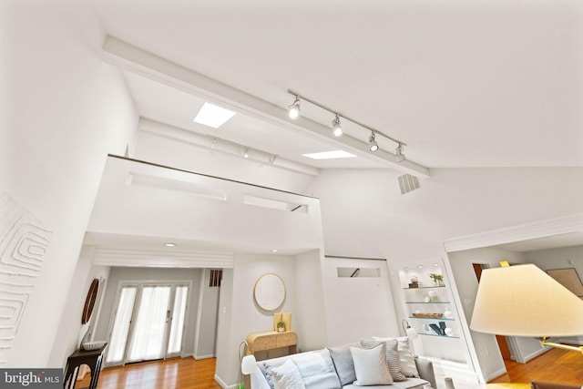1925 Upper Lake Dr, Reston, VA 20191 - living area featuring rail lighting, wood finished floors, and high vaulted ceiling
