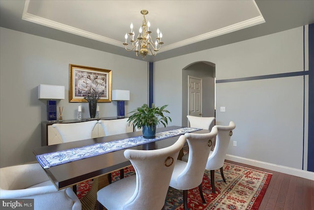 704 Goddard Dr, York, PA 17402 - dining space featuring arched walkways, an inviting chandelier, baseboards, and ornamental molding
