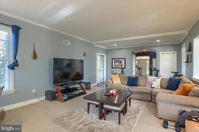 704 Goddard Dr, York, PA 17402 - carpeted living room with arched walkways, visible vents, baseboards, and ornamental molding