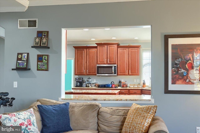 704 Goddard Dr, York, PA 17402 - kitchen with crown molding, stainless steel microwave, visible vents, and recessed lighting