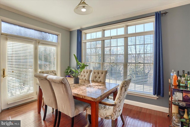704 Goddard Dr, York, PA 17402 - dining space featuring baseboards, ornamental molding, and hardwood / wood-style flooring