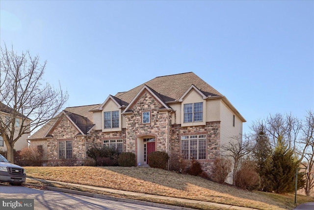 704 Goddard Dr, York, PA 17402 - traditional-style house featuring roof with shingles, stucco siding, and stone siding