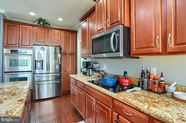 704 Goddard Dr, York, PA 17402 - kitchen with stainless steel appliances, light stone countertops, crown molding, and dark wood finished floors