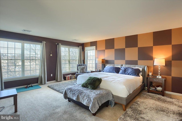 704 Goddard Dr, York, PA 17402 - carpeted bedroom with visible vents, baseboards, and an accent wall
