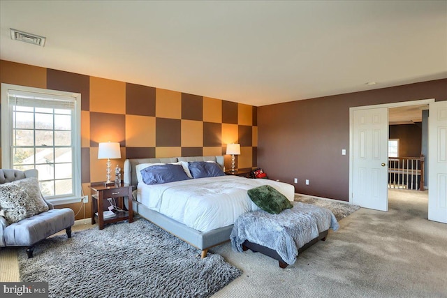 704 Goddard Dr, York, PA 17402 - bedroom featuring an accent wall, baseboards, carpet, and visible vents