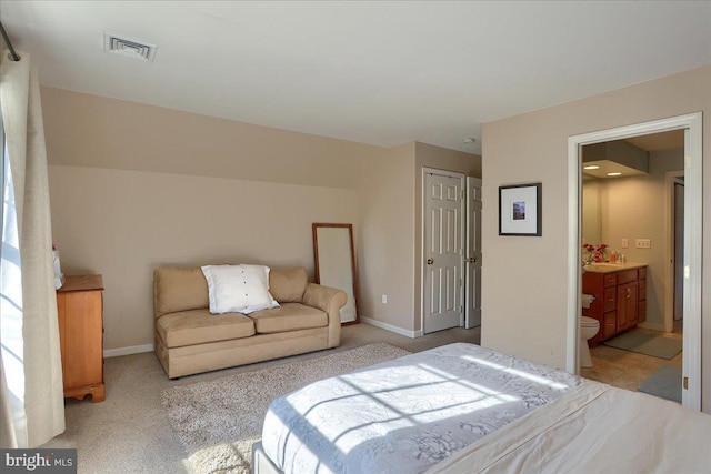 704 Goddard Dr, York, PA 17402 - bedroom with connected bathroom, a closet, light colored carpet, visible vents, and baseboards