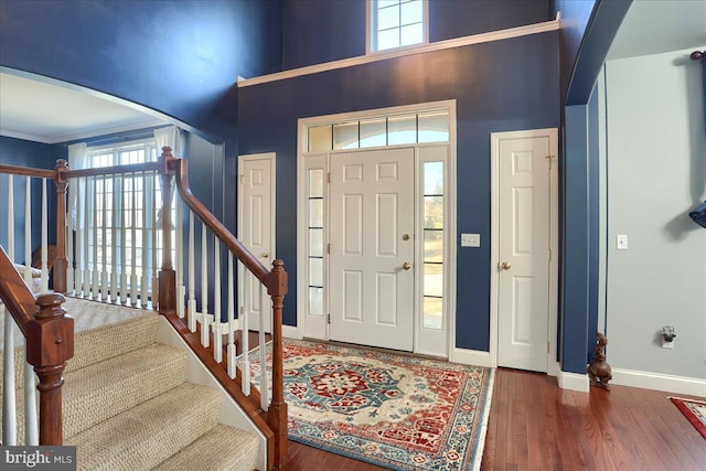 704 Goddard Dr, York, PA 17402 - foyer with arched walkways, plenty of natural light, baseboards, and wood finished floors