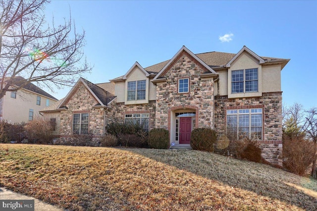 704 Goddard Dr, York, PA 17402 - traditional home with roof with shingles, stucco siding, stone siding, and a front yard