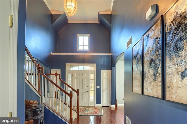704 Goddard Dr, York, PA 17402 - entryway featuring visible vents, arched walkways, ornamental molding, stairway, and wood finished floors