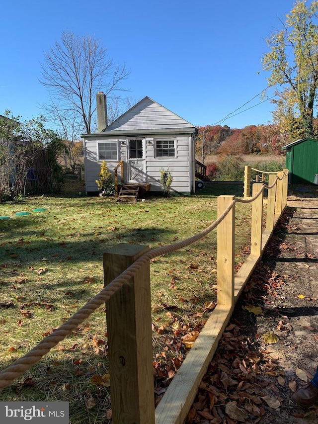 15 Higginsville Ln, Mount Royal, NJ 08061 - exterior space featuring a front lawn, fence, entry steps, and a chimney