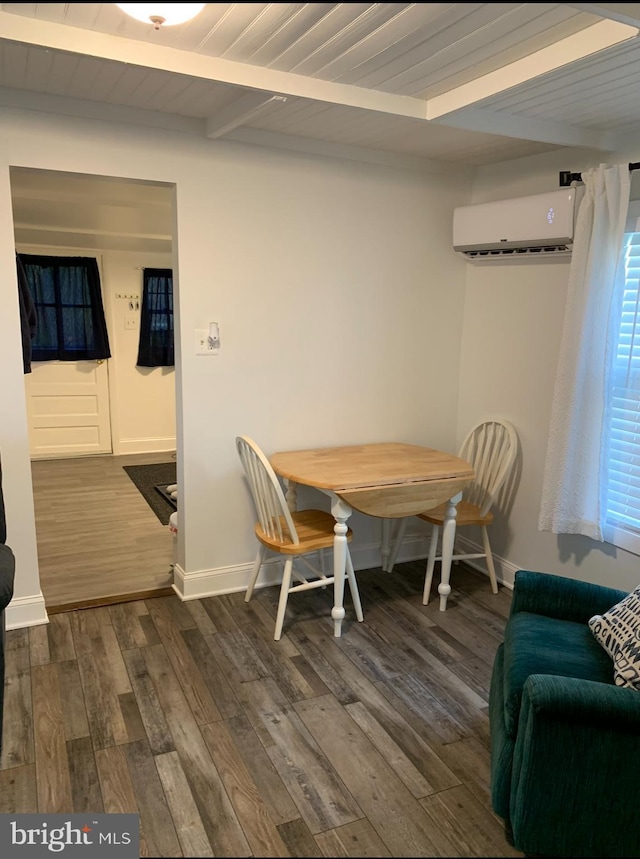 15 Higginsville Ln, Mount Royal, NJ 08061 - dining area with baseboards, a wall mounted AC, beamed ceiling, and dark wood finished floors