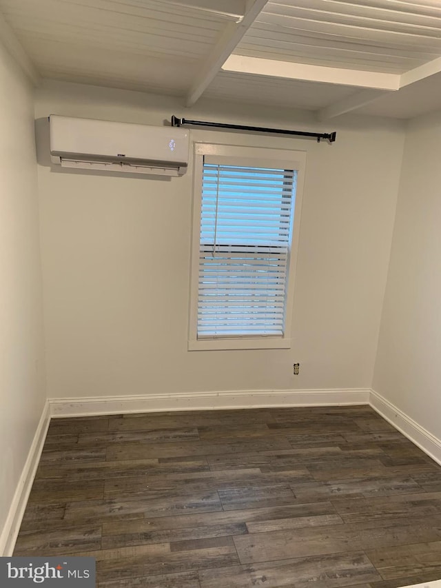 15 Higginsville Ln, Mount Royal, NJ 08061 - empty room featuring beam ceiling, dark wood-type flooring, a wall mounted air conditioner, and baseboards
