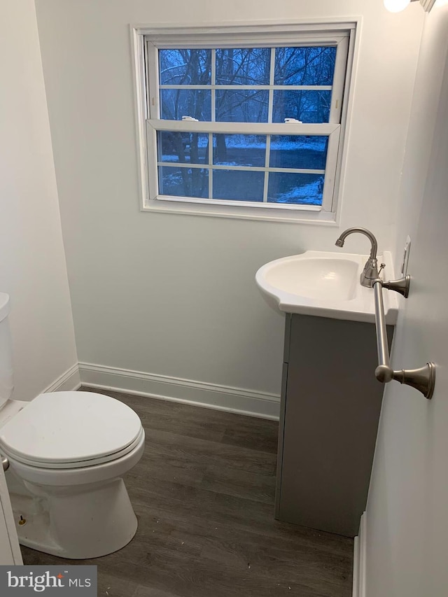 15 Higginsville Ln, Mount Royal, NJ 08061 - bathroom with baseboards, wood finished floors, toilet, and vanity