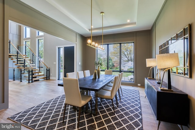 1127 Guilford Ct, Mclean, VA 22101 - dining area with wood finished floors, an inviting chandelier, and a healthy amount of sunlight