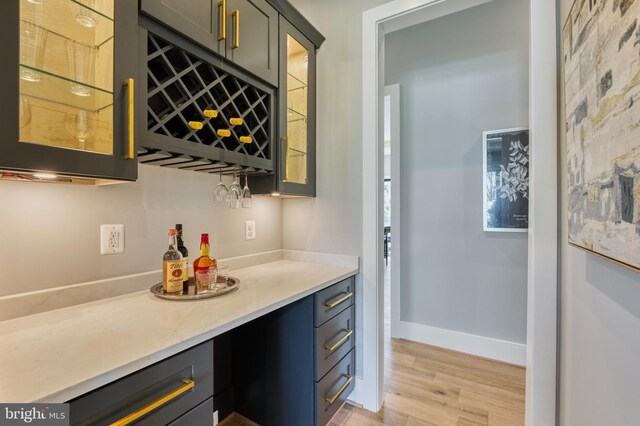 1127 Guilford Ct, Mclean, VA 22101 - bar featuring a dry bar, light wood finished floors, and baseboards