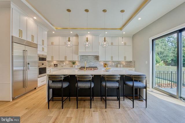 1127 Guilford Ct, Mclean, VA 22101 - kitchen with white cabinets, stainless steel built in fridge, a tray ceiling, and light countertops