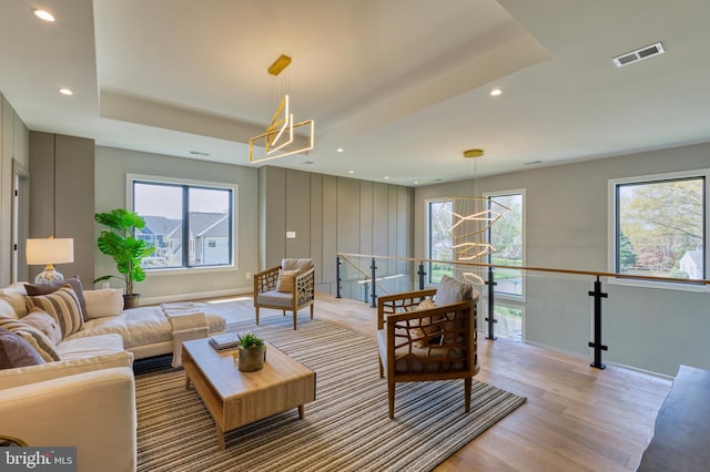 1127 Guilford Ct, Mclean, VA 22101 - living area featuring visible vents, light wood-style flooring, plenty of natural light, and a chandelier