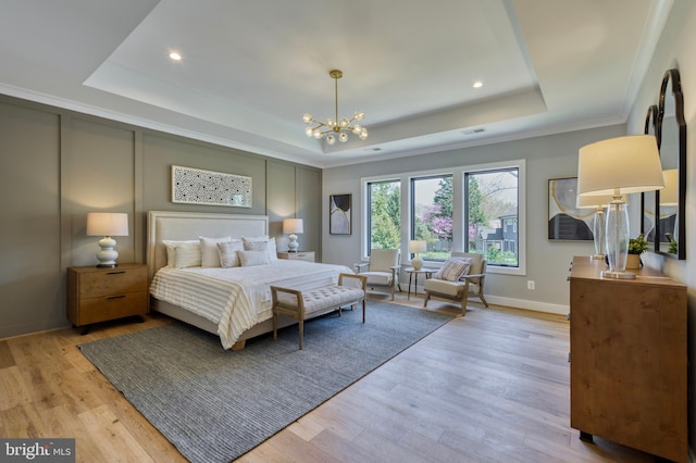 1127 Guilford Ct, Mclean, VA 22101 - bedroom featuring a chandelier, light wood finished floors, and a tray ceiling