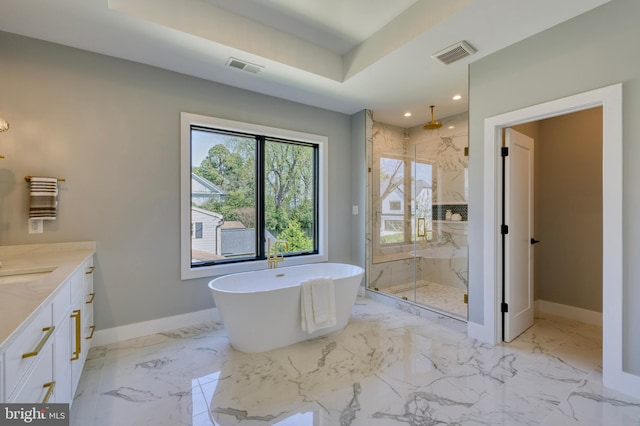 1127 Guilford Ct, Mclean, VA 22101 - full bathroom with vanity, baseboards, a soaking tub, a marble finish shower, and visible vents