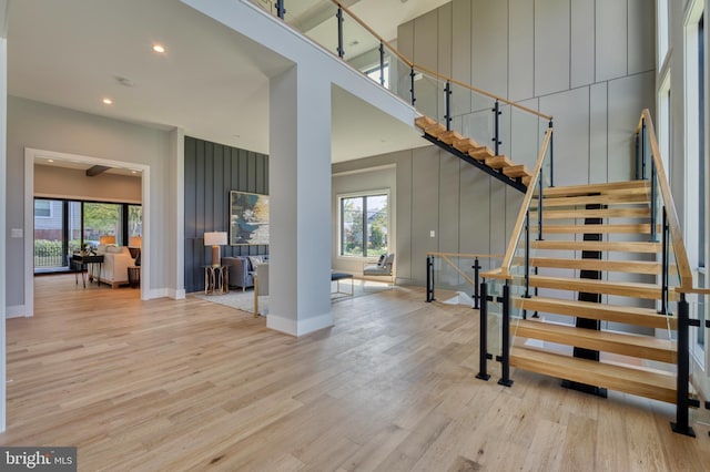 1127 Guilford Ct, Mclean, VA 22101 - stairway with wood finished floors, a towering ceiling, baseboards, and recessed lighting