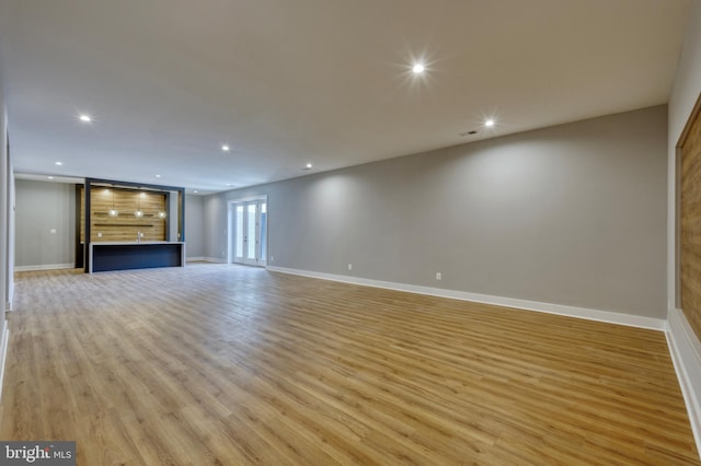 1127 Guilford Ct, Mclean, VA 22101 - unfurnished living room featuring baseboards, recessed lighting, and light wood-style floors