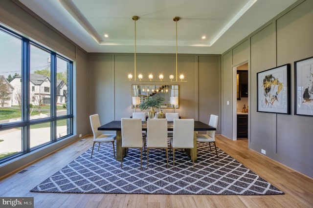 1127 Guilford Ct, Mclean, VA 22101 - dining space featuring a decorative wall, a raised ceiling, and plenty of natural light