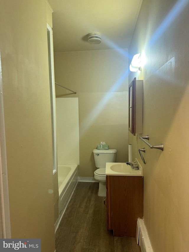 4561 N Camac St, Philadelphia, PA 19140 - bathroom with vanity, toilet, baseboard heating, wood finished floors, and shower / bathing tub combination