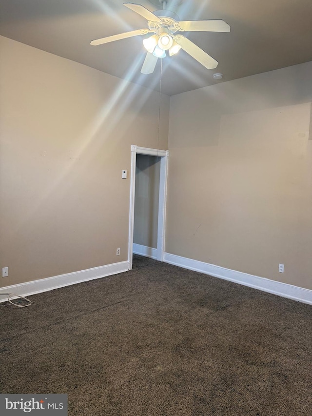 4561 N Camac St, Philadelphia, PA 19140 - unfurnished room featuring dark carpet, baseboards, and a ceiling fan