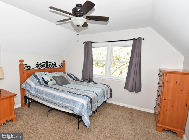 carpeted bedroom with baseboards, ceiling fan, and lofted ceiling