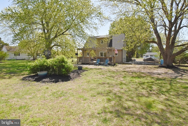 view of yard featuring a deck and fence