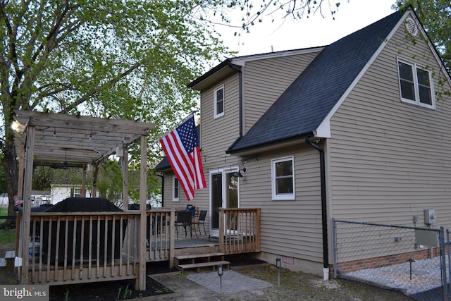 6190 Ayrshire Dr, Salisbury, MD 21801 - back of property with a deck, a pergola, roof with shingles, and crawl space